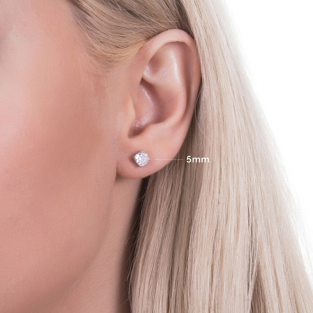 Model wearing Solitaire Cushion CZ Stud Earrings in Sterling Silver, 5mm