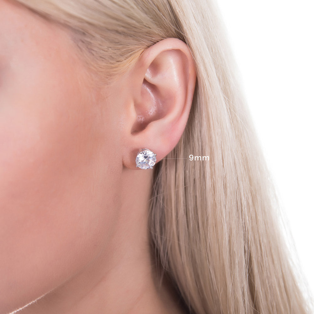 Model wearing Solitaire Round CZ Stud Earrings in Sterling Silver, 6 of 14
