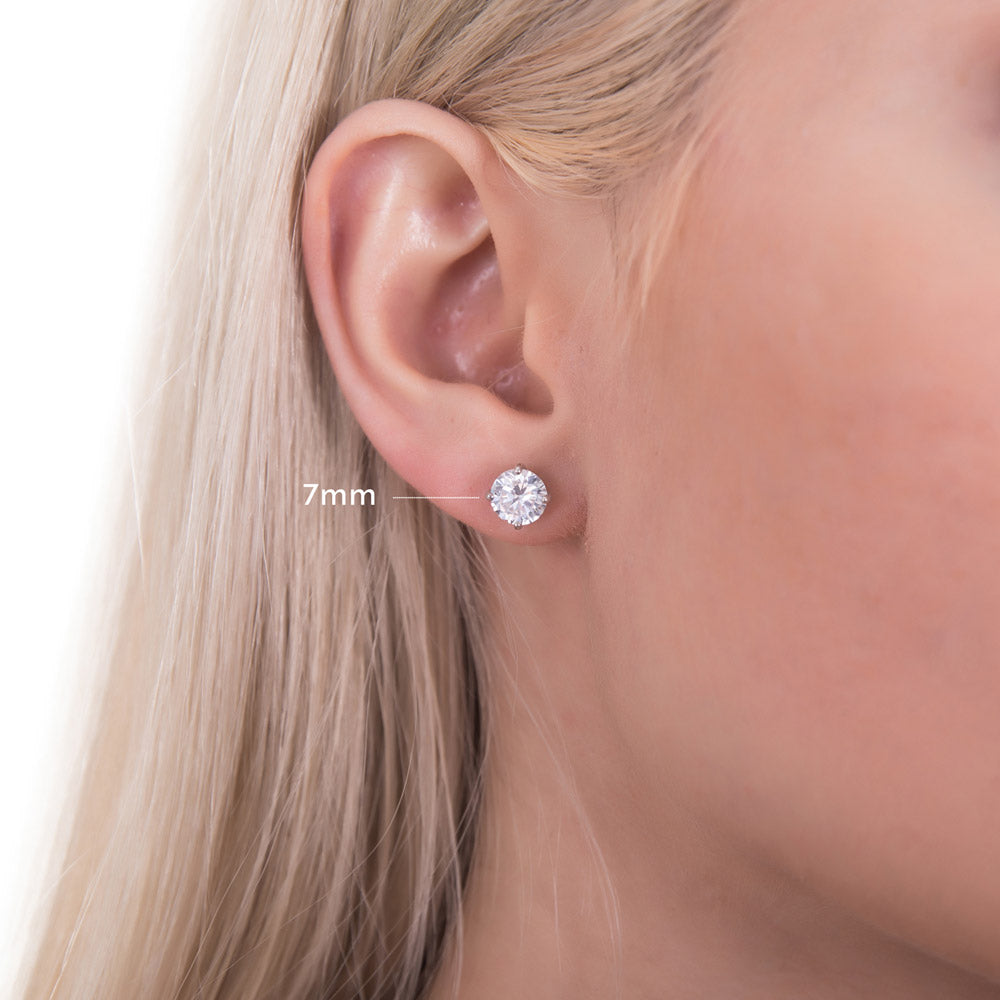 Model wearing Solitaire Round CZ Stud Earrings in Sterling Silver, 7 of 14
