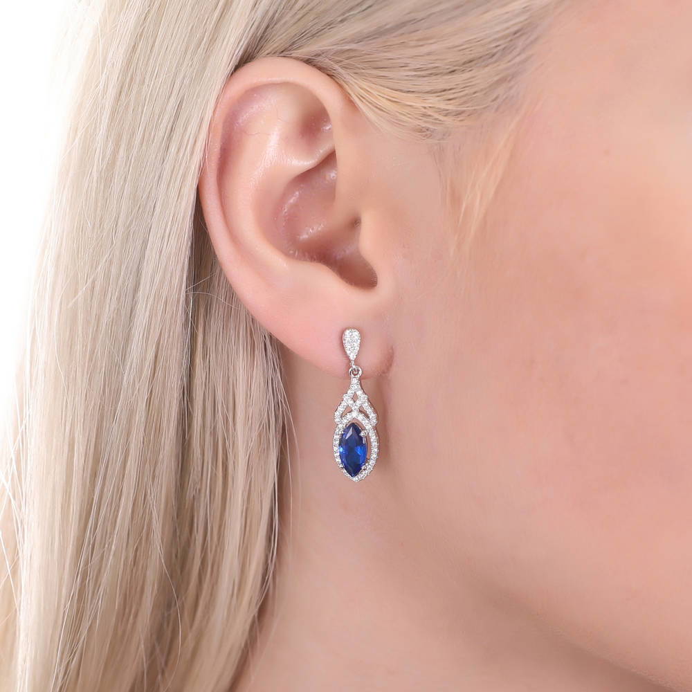Model wearing Halo Simulated Blue Sapphire Marquise CZ Set in Sterling Silver, 6 of 9
