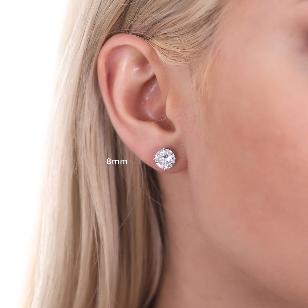 Model wearing Solitaire Round CZ Stud Earrings in Sterling Silver, 8 of 14