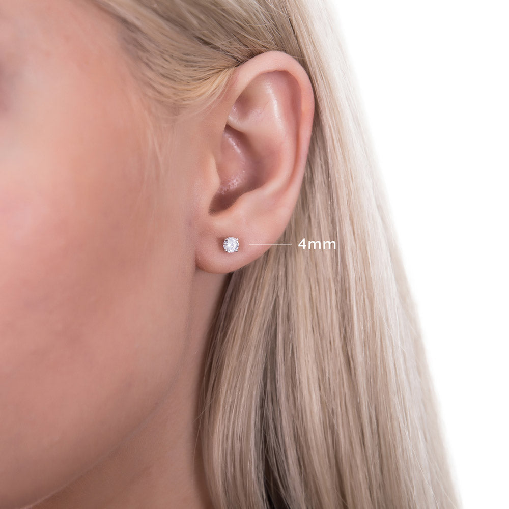 Model wearing Solitaire Round CZ Stud Earrings in Sterling Silver, 9 of 14