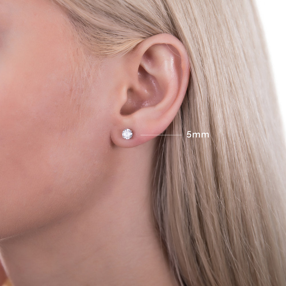 Model wearing Solitaire Round CZ Stud Earrings in Sterling Silver, 10 of 14