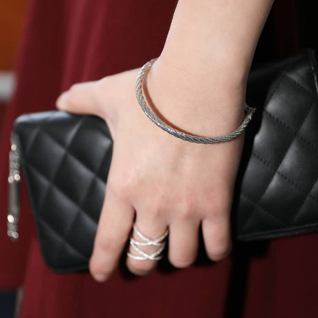Model Wearing Criss Cross Ring, Woven Strand Bracelet
