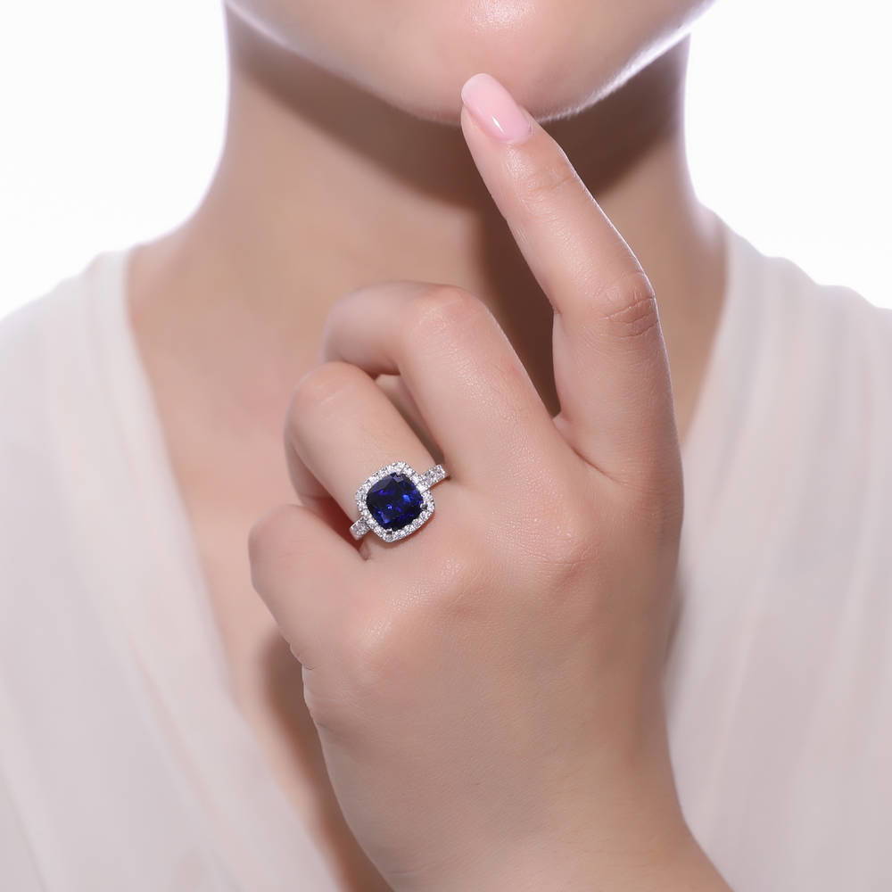 Model wearing Halo Simulated Blue Sapphire Cushion CZ Ring in Sterling Silver, 2 of 7