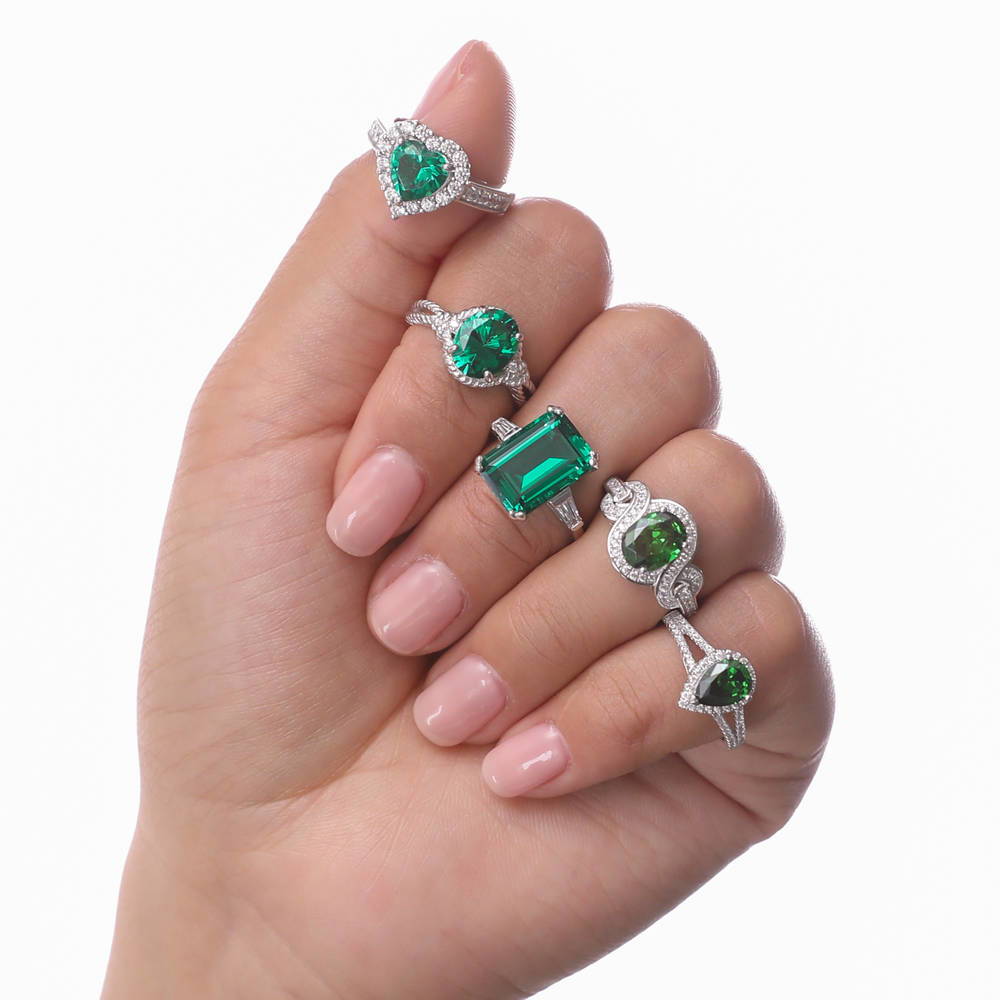 Model wearing Solitaire Emerald-Green Emerald Cut CZ Ring in Sterling Silver, 9 of 11