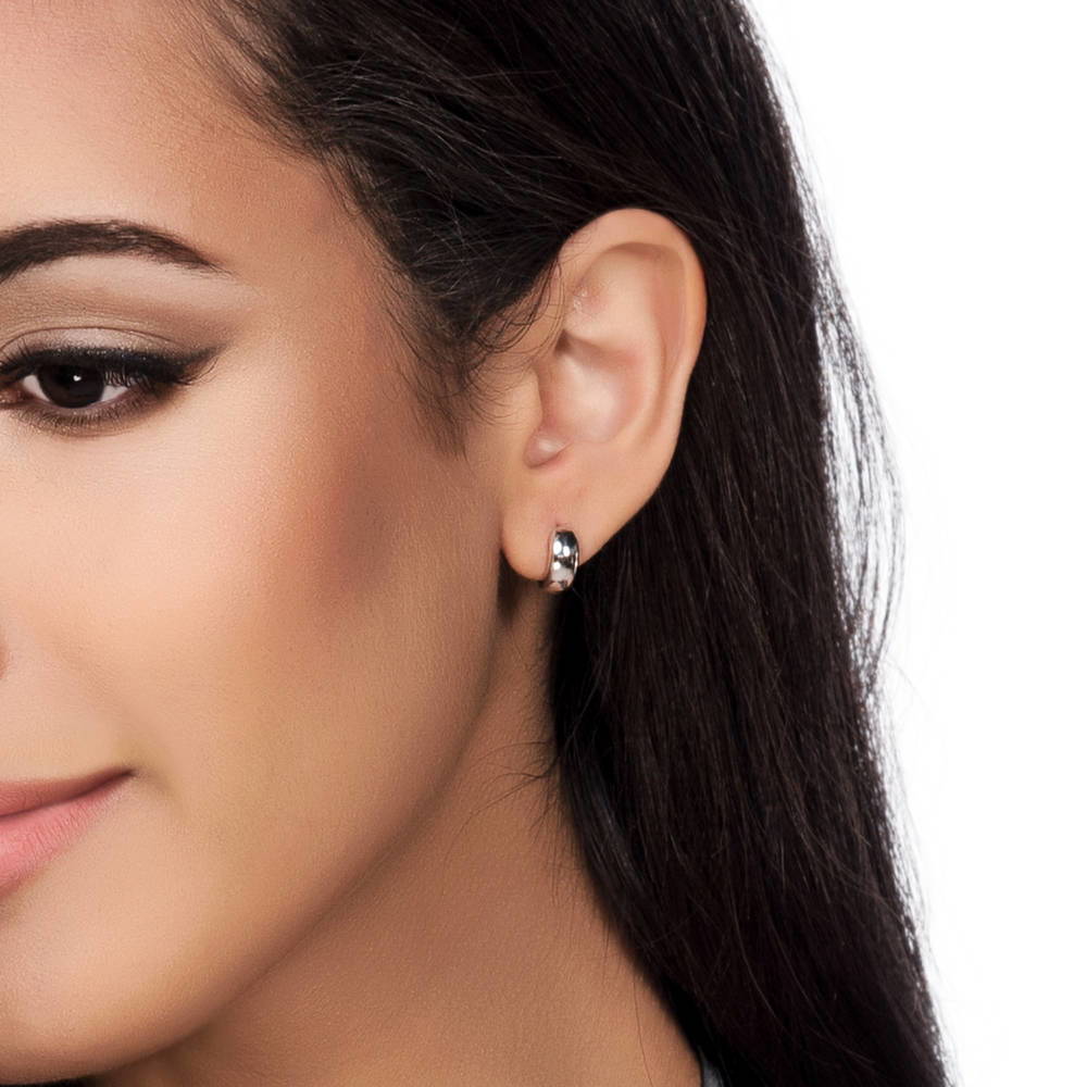 Model wearing Dome Huggie Earrings in Gold Flashed Sterling Silver, 2 Pairs, 7 of 13