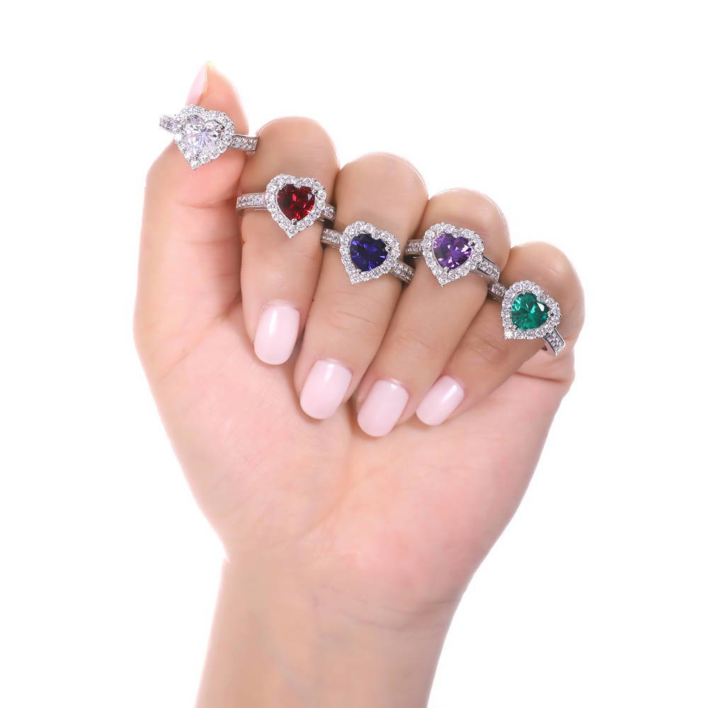 Model wearing Halo Heart Simulated Ruby Heart CZ Ring in Sterling Silver, 7 of 10
