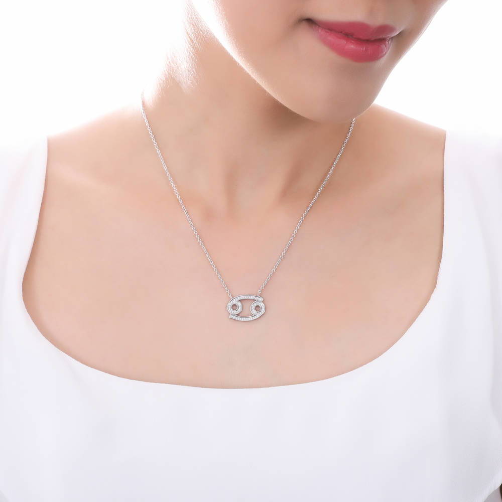 Model wearing Zodiac Cancer CZ Pendant Necklace in Sterling Silver, 2 of 6
