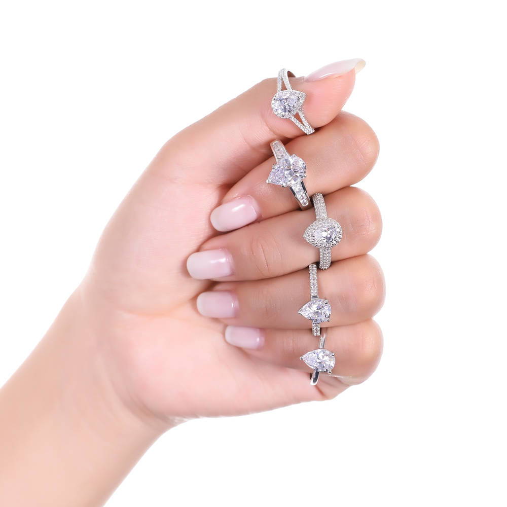 Model wearing Halo Pear Cut CZ Ring in Sterling Silver, 3 of 7