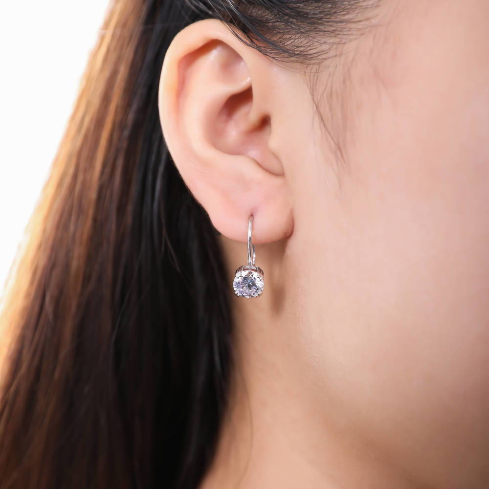 Model wearing Solitaire 2.5ct Round CZ Leverback Dangle Earrings in Sterling Silver, 2 of 3