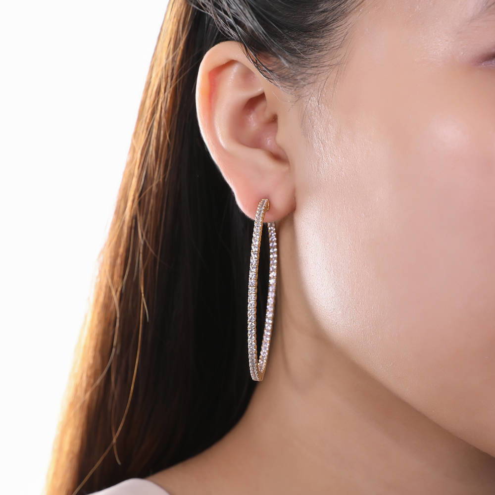 Model wearing CZ Large Inside-Out Hoop Earrings in Sterling Silver 2.2 inch, 9 of 15