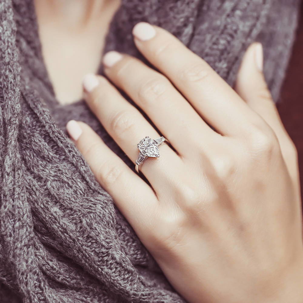 Model wearing Solitaire 1.8ct Pear CZ Ring in Sterling Silver, 2 of 7