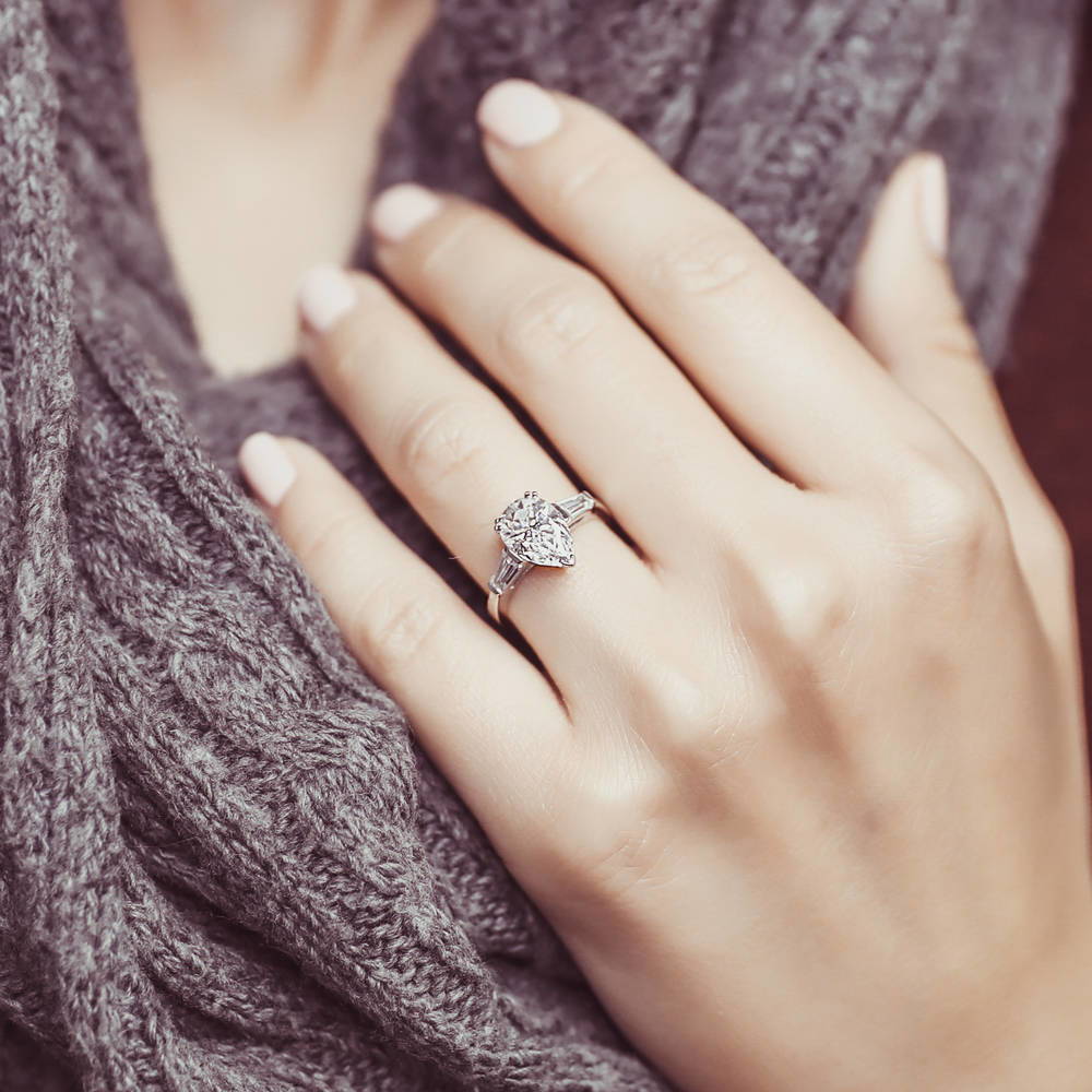 Model wearing Solitaire 1.8ct Pear CZ Ring in Sterling Silver, 2 of 9