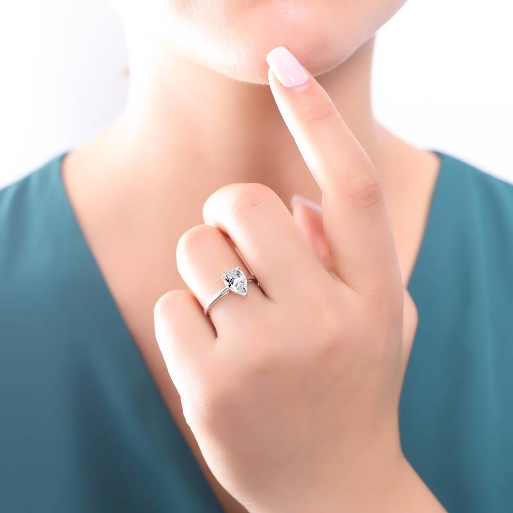 Model wearing Solitaire 1.8ct Pear CZ Ring in Sterling Silver, 3 of 12