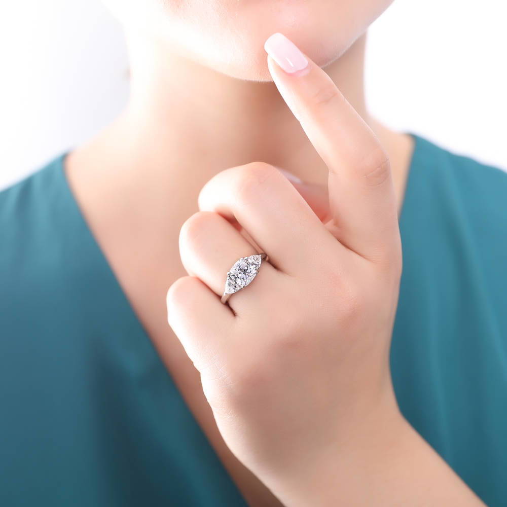 Model wearing 3-Stone 3ct Cushion CZ Ring in Sterling Silver, 3 of 10