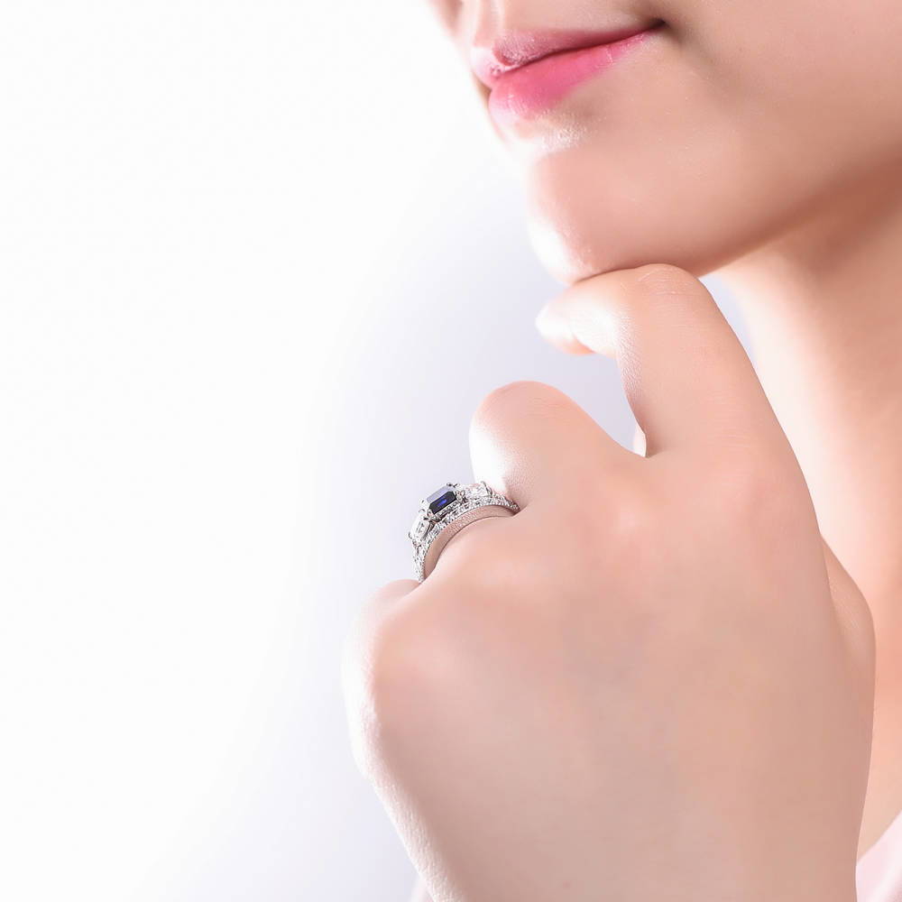 Model wearing 3-Stone Sapphire-Blue Princess CZ Ring Set in Sterling Silver, 3 of 9
