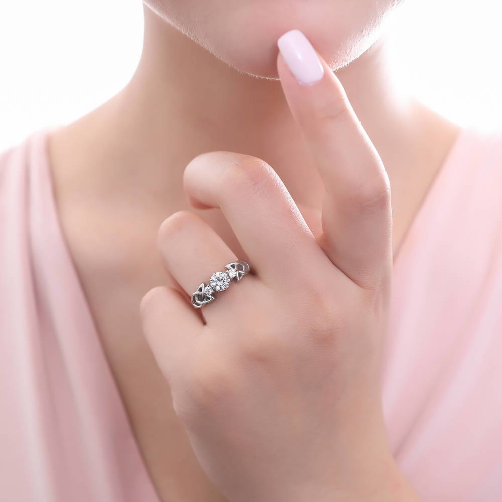 Model wearing 3-Stone Celtic Knot 0.8ct CZ Ring in Sterling Silver, 6 of 10