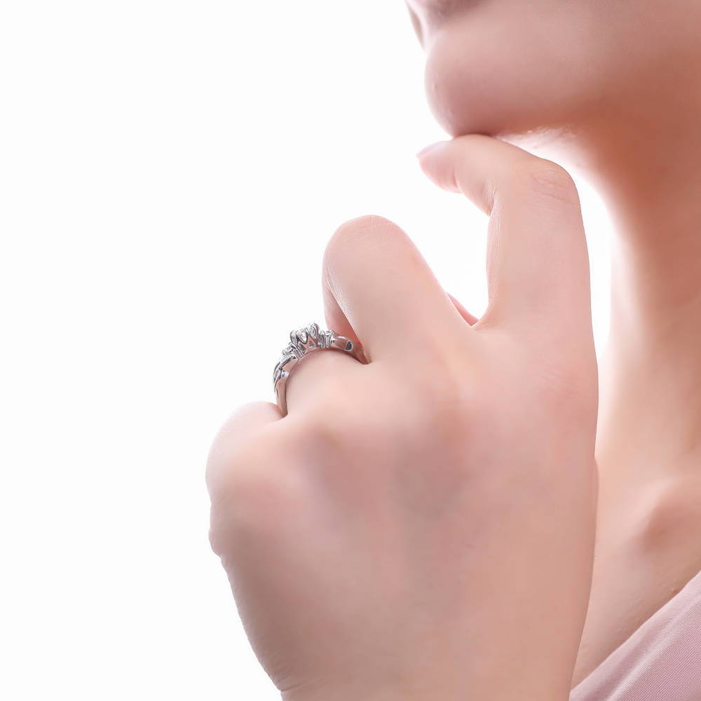 Model wearing 3-Stone Celtic Knot Round CZ Ring in Sterling Silver, 6 of 9