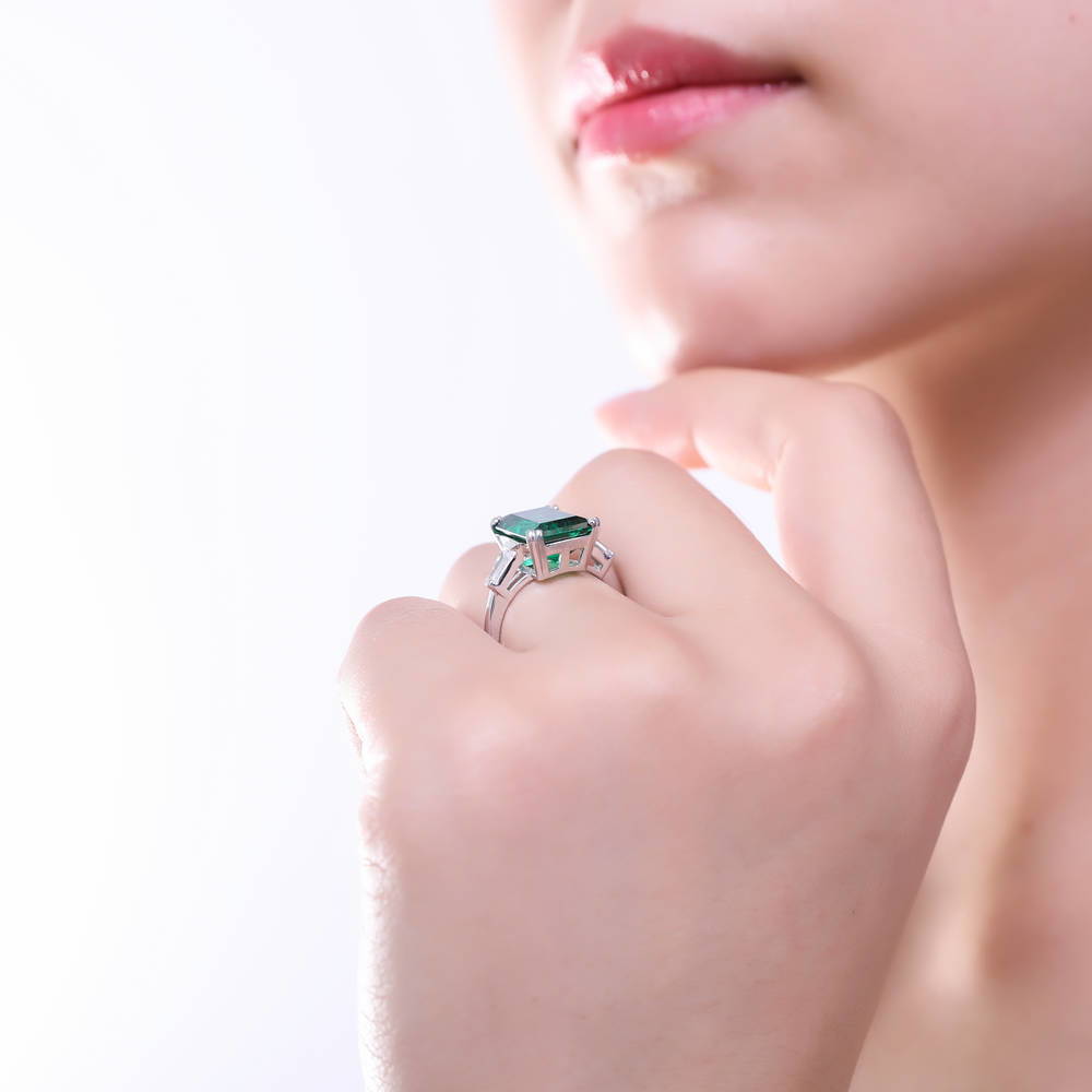 Model wearing Solitaire Emerald-Green Emerald Cut CZ Ring in Sterling Silver, 6 of 11