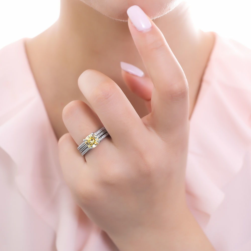 Model wearing Solitaire 3ct Canary Yellow Cushion CZ Ring Set in Sterling Silver, 2 of 10