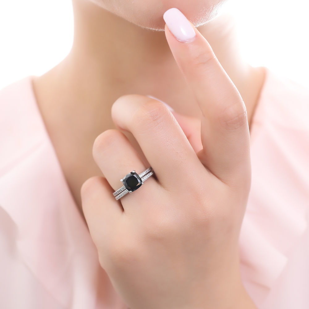 Model wearing Solitaire Black Cushion CZ Stackable Ring Set in Sterling Silver, 2 of 10