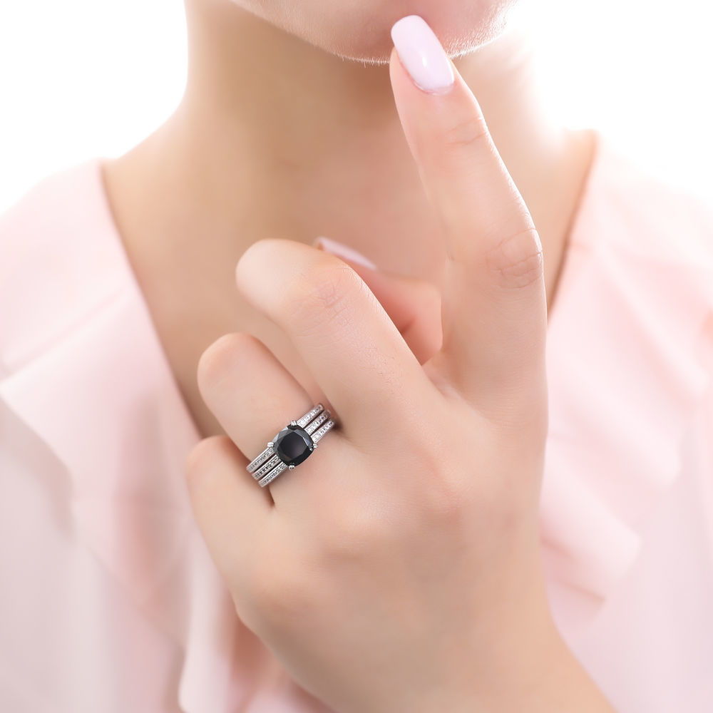 Model wearing Solitaire 3ct Black Cushion CZ Ring Set in Sterling Silver, 2 of 10