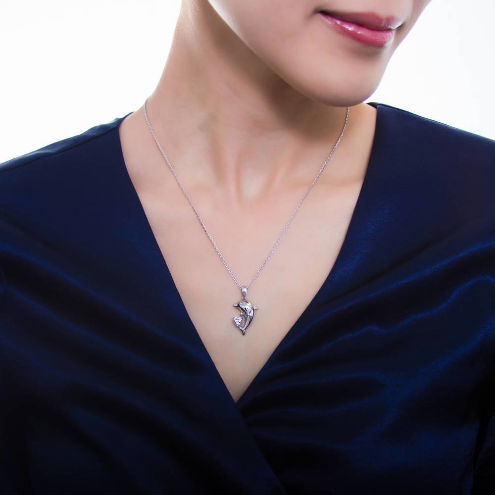 Model wearing Dolphin CZ Pendant Necklace in Sterling Silver, 2 of 7