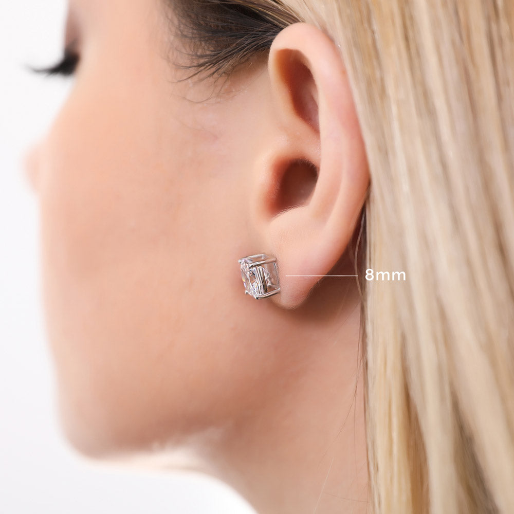 Model wearing Solitaire Cushion CZ Stud Earrings in Sterling Silver, 6mm