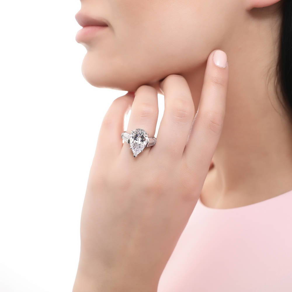 Model wearing 3-Stone 8ct Pear CZ Ring in Sterling Silver, 2 of 9