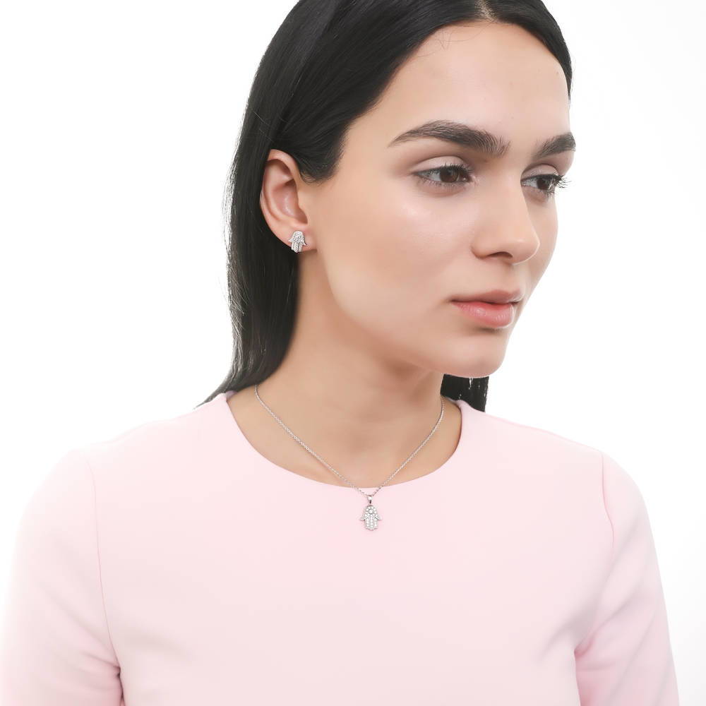 Model wearing Hamsa Hand CZ Stud Earrings in Sterling Silver, 6 of 8