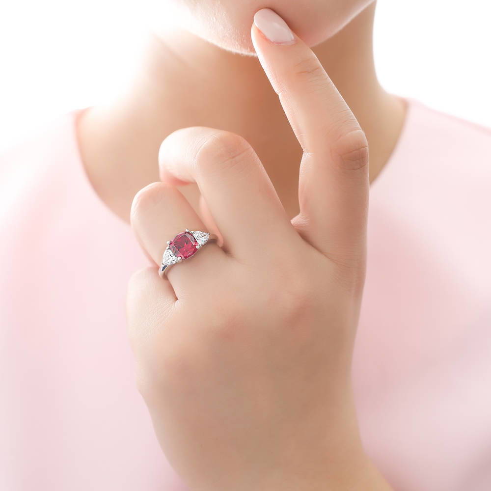 Model wearing 3-Stone Simulated Ruby Cushion CZ Ring Set in Sterling Silver, 6 of 11