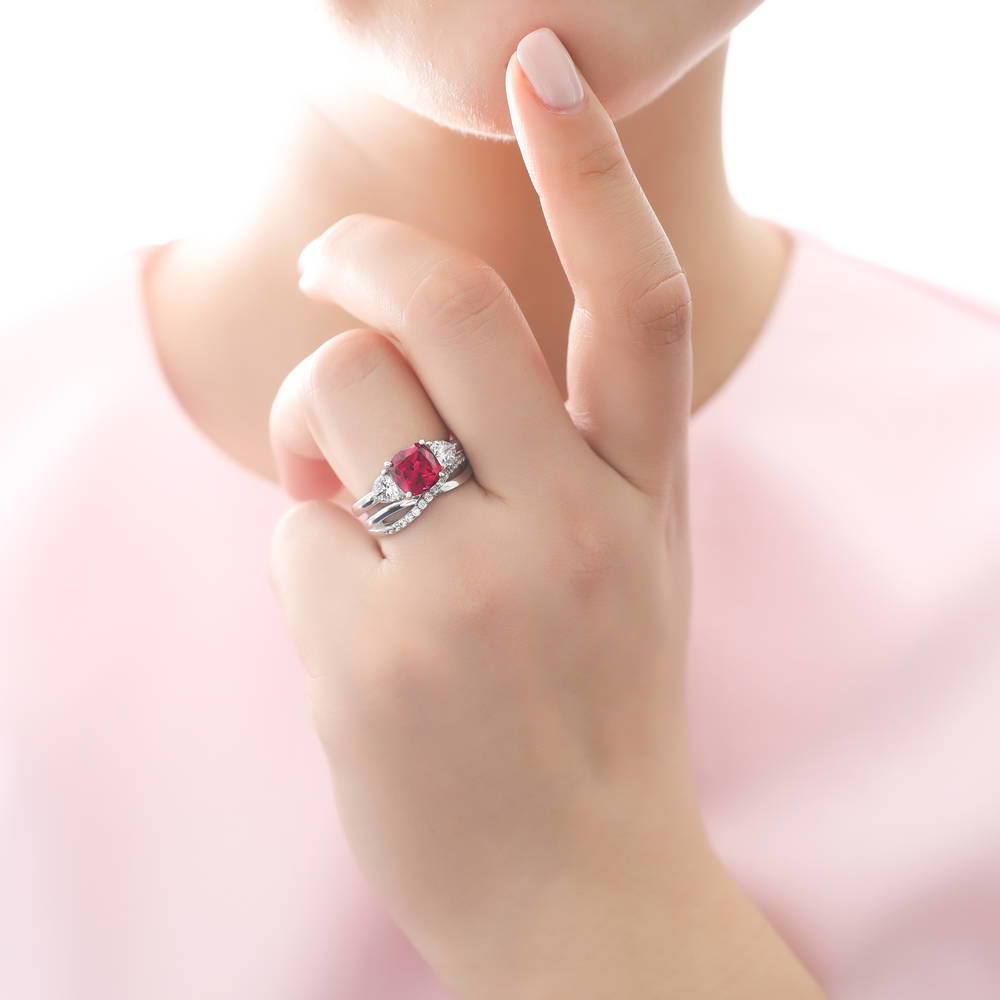 Model wearing 3-Stone Criss Cross 3ct Ruby-Red CZ Ring Set in Sterling Silver, 2 of 12