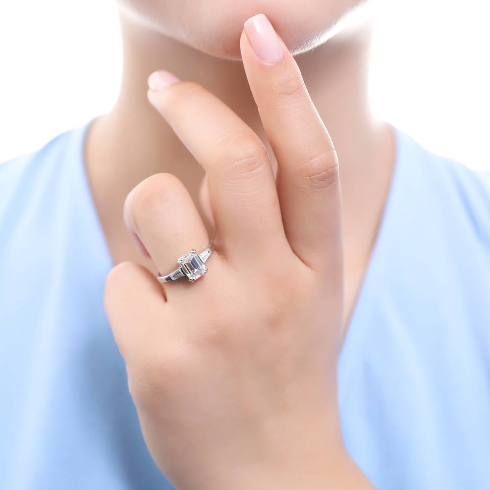 Model wearing 3-Stone Wishbone 2.1ct Emerald Cut CZ Ring Set in Sterling Silver, 13 of 20