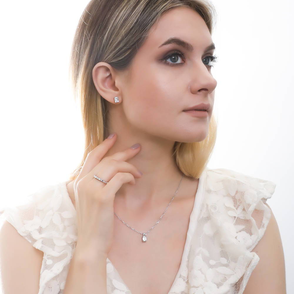 Model wearing Solitaire 1ct Emerald Cut CZ Necklace in Sterling Silver, 2 of 7