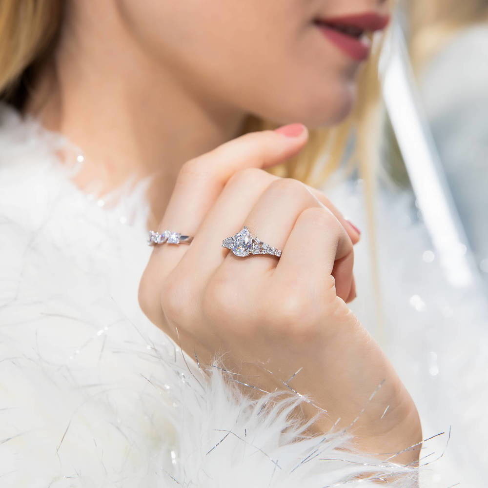 Model wearing Solitaire 1.3ct Pear CZ Ring in Sterling Silver, 3 of 7