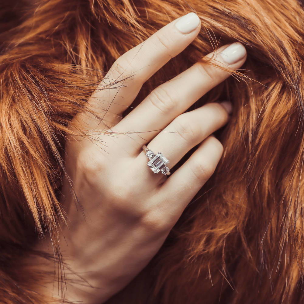 Model wearing 3-Stone 2.6ct Emerald Cut CZ Ring in Sterling Silver, 9 of 14
