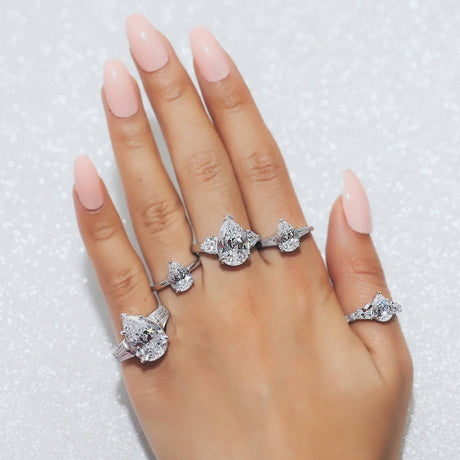 Image Contain: Model Wearing 3-Stone Ring, Solitaire Ring, Solitaire with Side Stones Ring