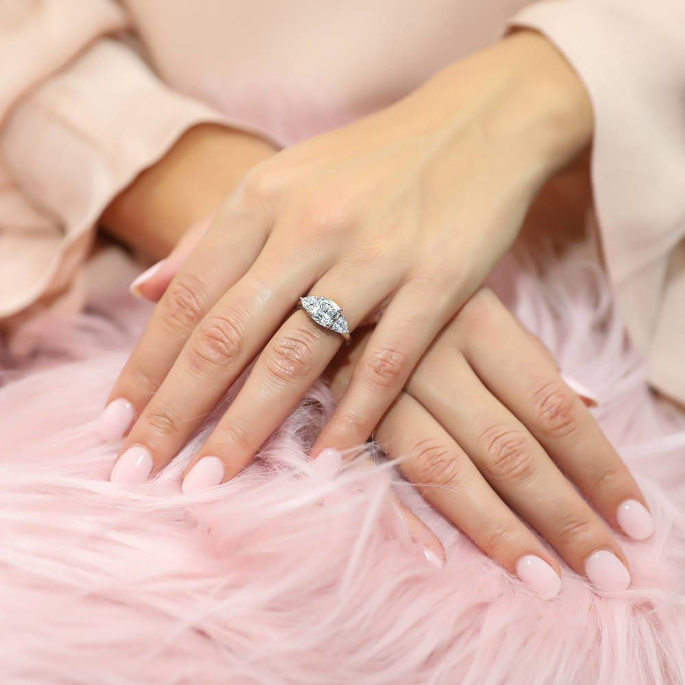 Model wearing 3-Stone 3ct Cushion CZ Ring in Sterling Silver, 2 of 10