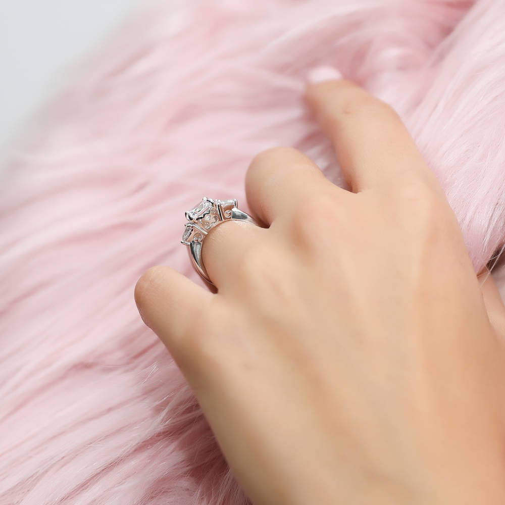 Model wearing 3-Stone 3ct Cushion CZ Ring in Sterling Silver, 6 of 10