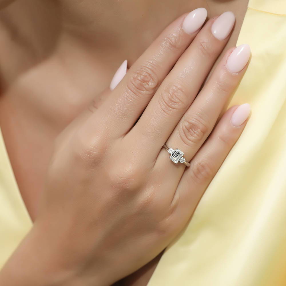 Model wearing 3-Stone 1ct Emerald Cut CZ Ring Set in Sterling Silver, 10 of 13