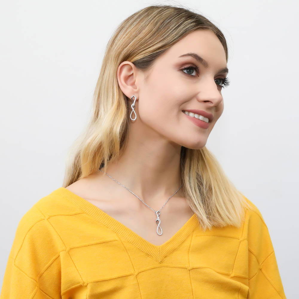 Model wearing Infinity CZ Pendant Necklace in Sterling Silver, 3 of 6