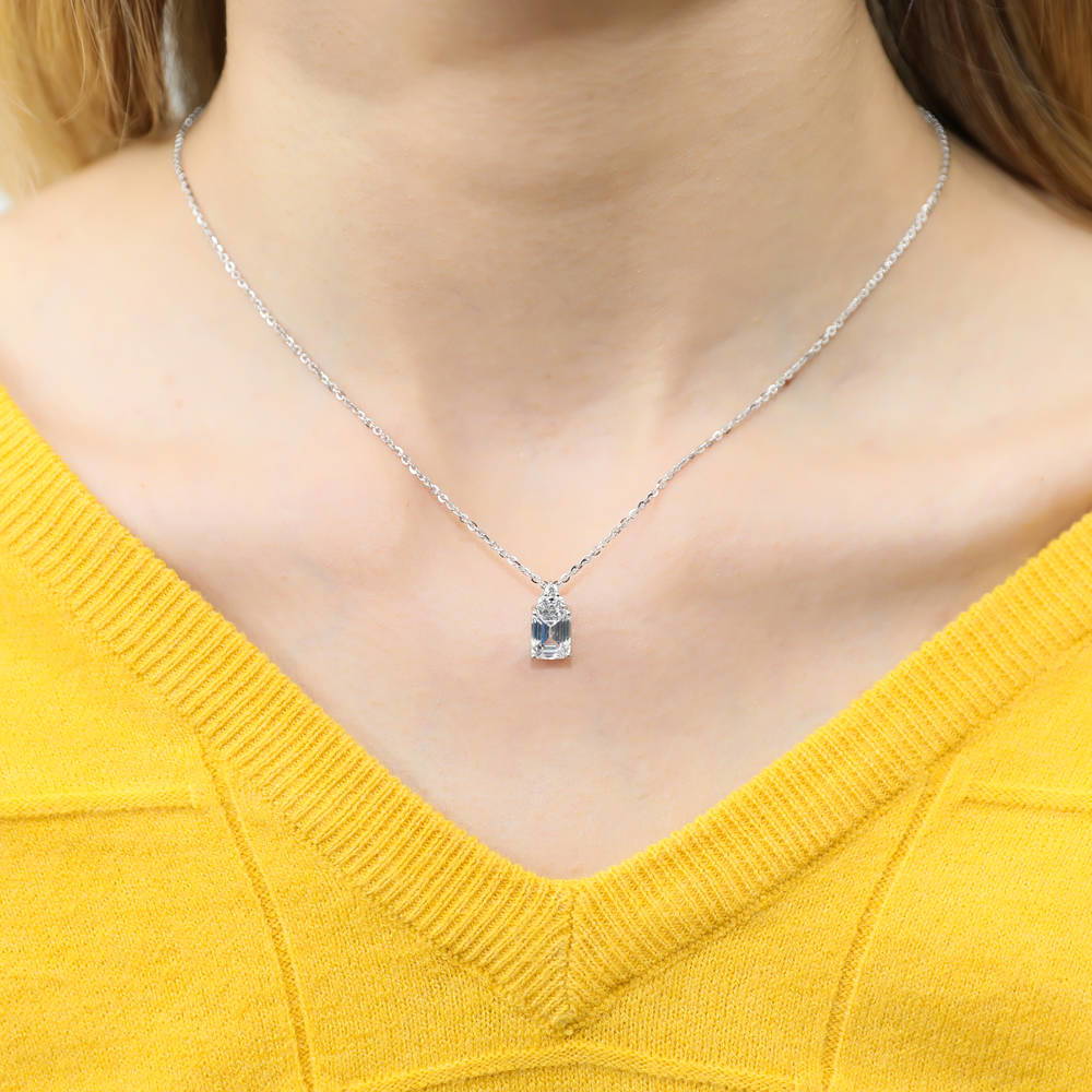 Model wearing Solitaire 2.1ct Emerald Cut CZ Necklace in Sterling Silver, 2 of 7