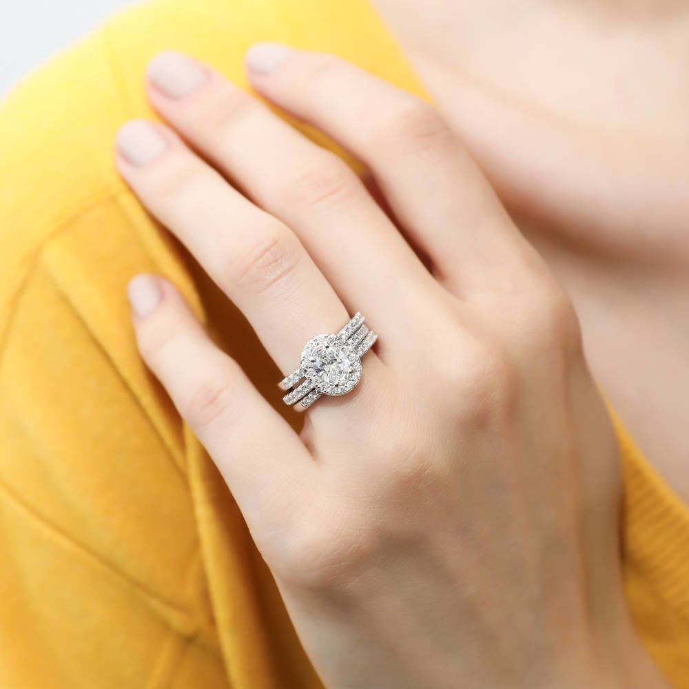 Model wearing Halo Oval Cut CZ Ring in Sterling Silver, 12 of 15