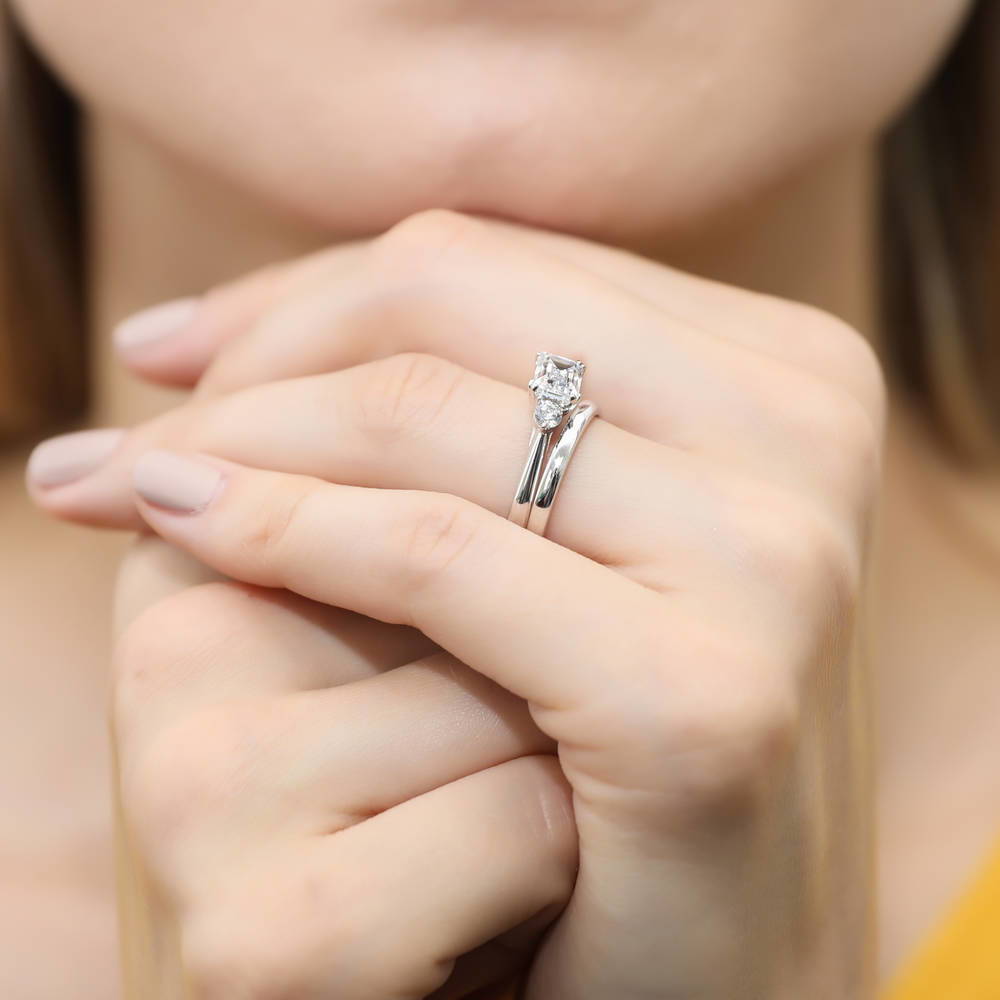 Model wearing 3-Stone East-West 1ct Emerald Cut CZ Ring Set in Sterling Silver, 7 of 13