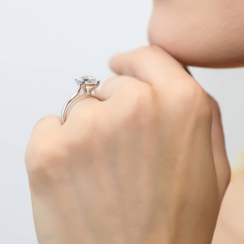 Model wearing Solitaire 2.6ct Emerald Cut CZ Ring in Sterling Silver, 6 of 8