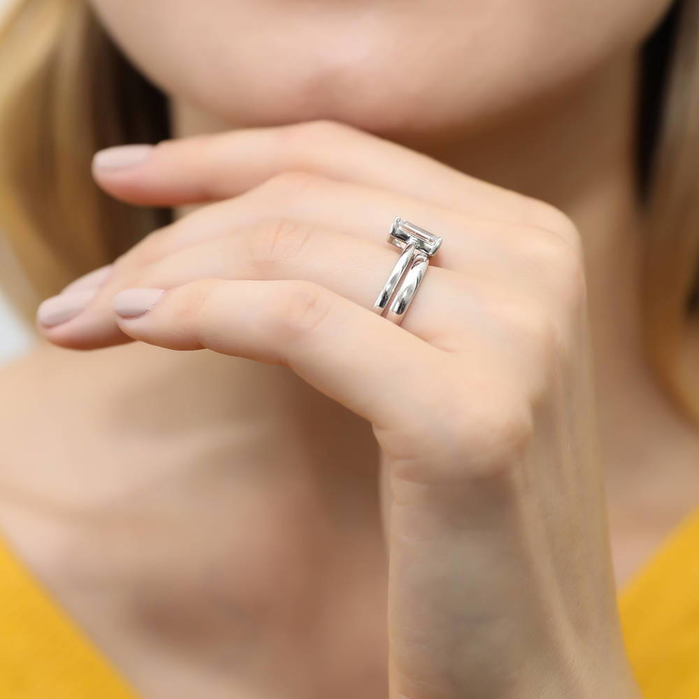 Model wearing Solitaire 2.1ct Emerald Cut CZ Ring Set in Sterling Silver, 10 of 14