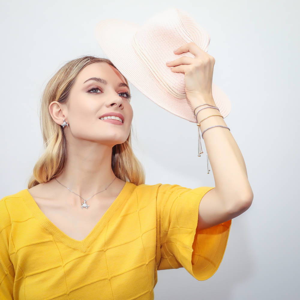 Model wearing CZ Tennis Bracelet Gold Flashed, Champagne Color