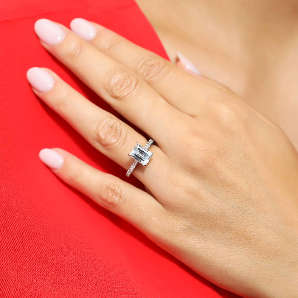 Model wearing Solitaire 2.6ct Emerald Cut CZ Ring in Sterling Silver, 6 of 8