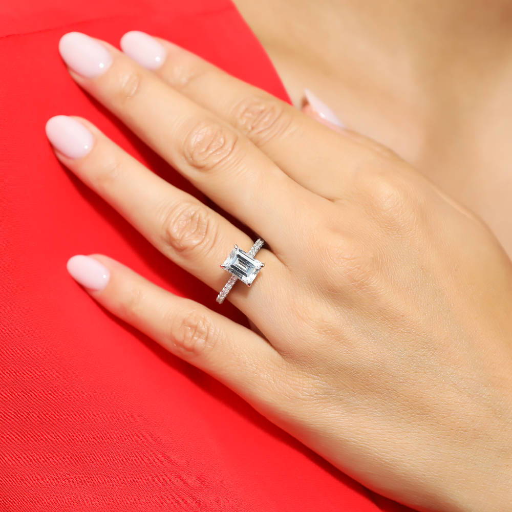 Model wearing Solitaire 2.6ct Emerald Cut CZ Ring Set in Sterling Silver, 11 of 13